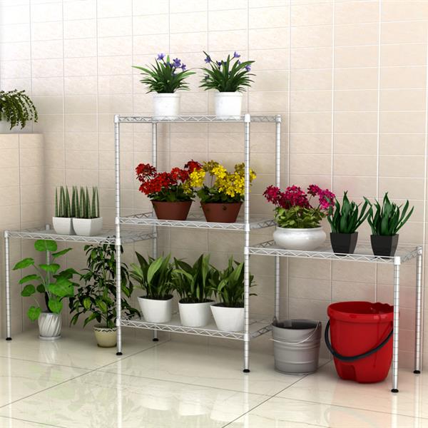Metal shelving unit with potted plants against a tiled wall.